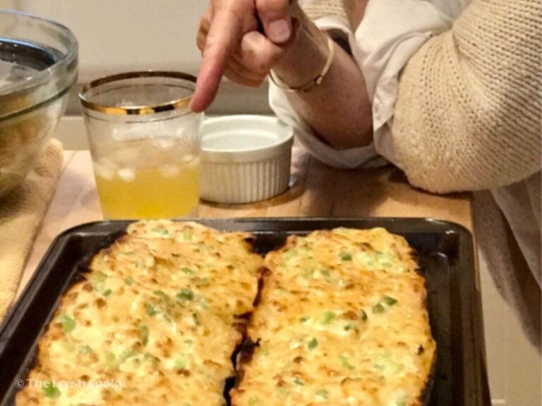 Our friend Liz, pointing at her creation of cheesy bread aka Liz Bread.