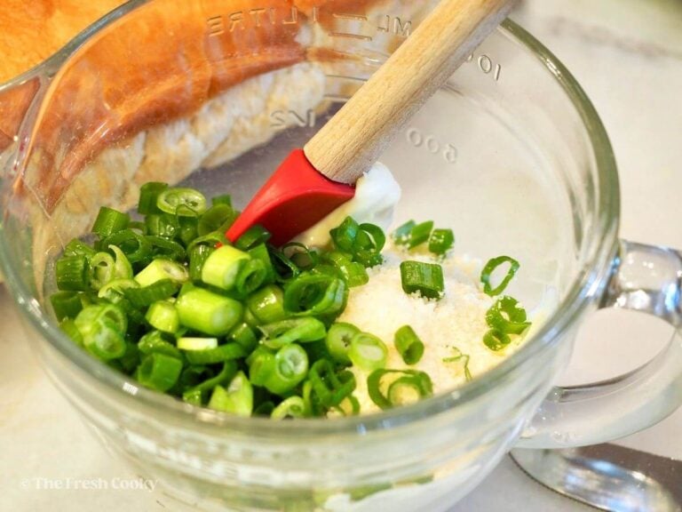 Combine the mayo, cheese, garlic and green onions.