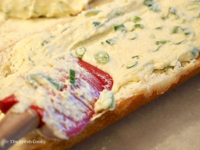 Evenly divide the mayo and cheese mixture between the two halves.