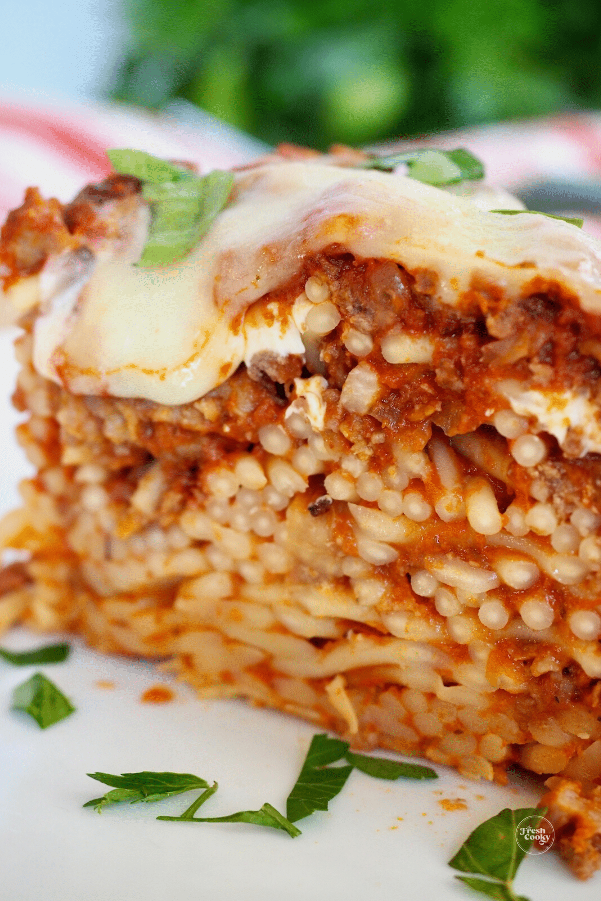 Close up of baked spaghetti pie on plate.