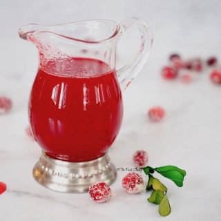 Cranberry Simple Syrup image of a pitcher.