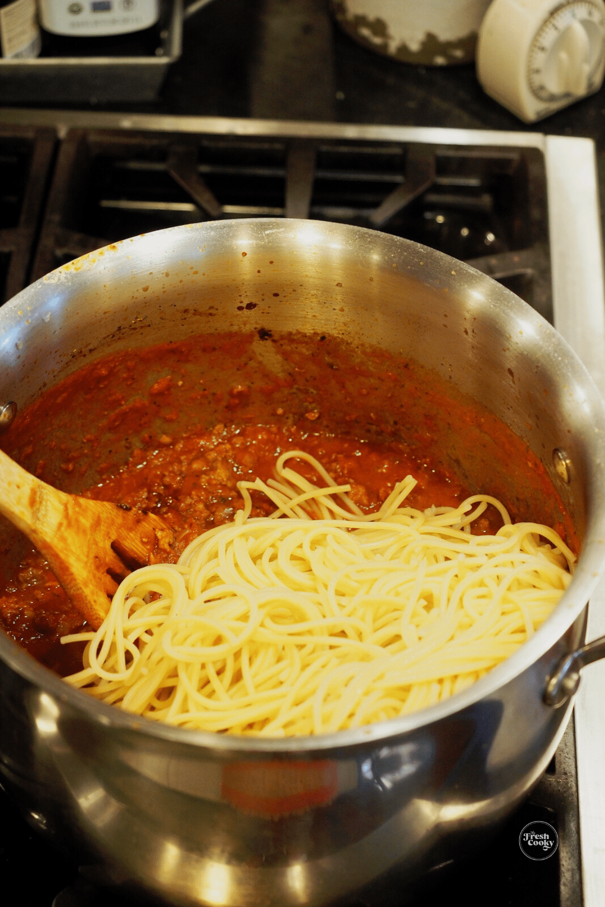 Mix spaghetti into remaining sauce.