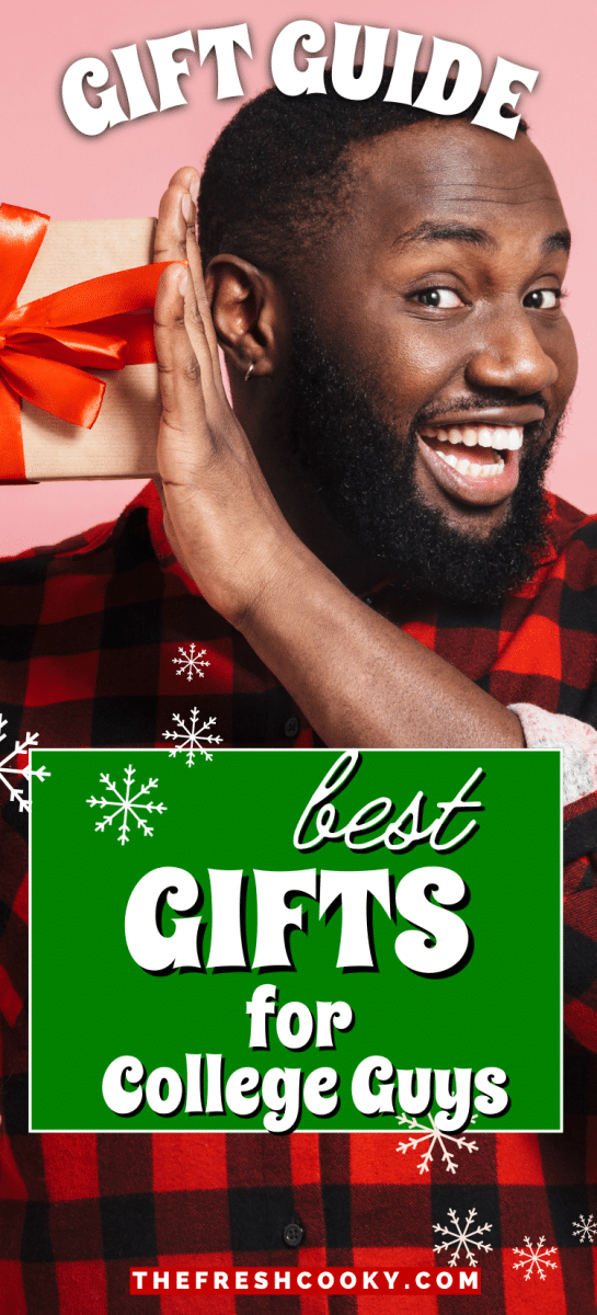 African American guy holding a gift with a big smile, to pin for gift guide for college guys.