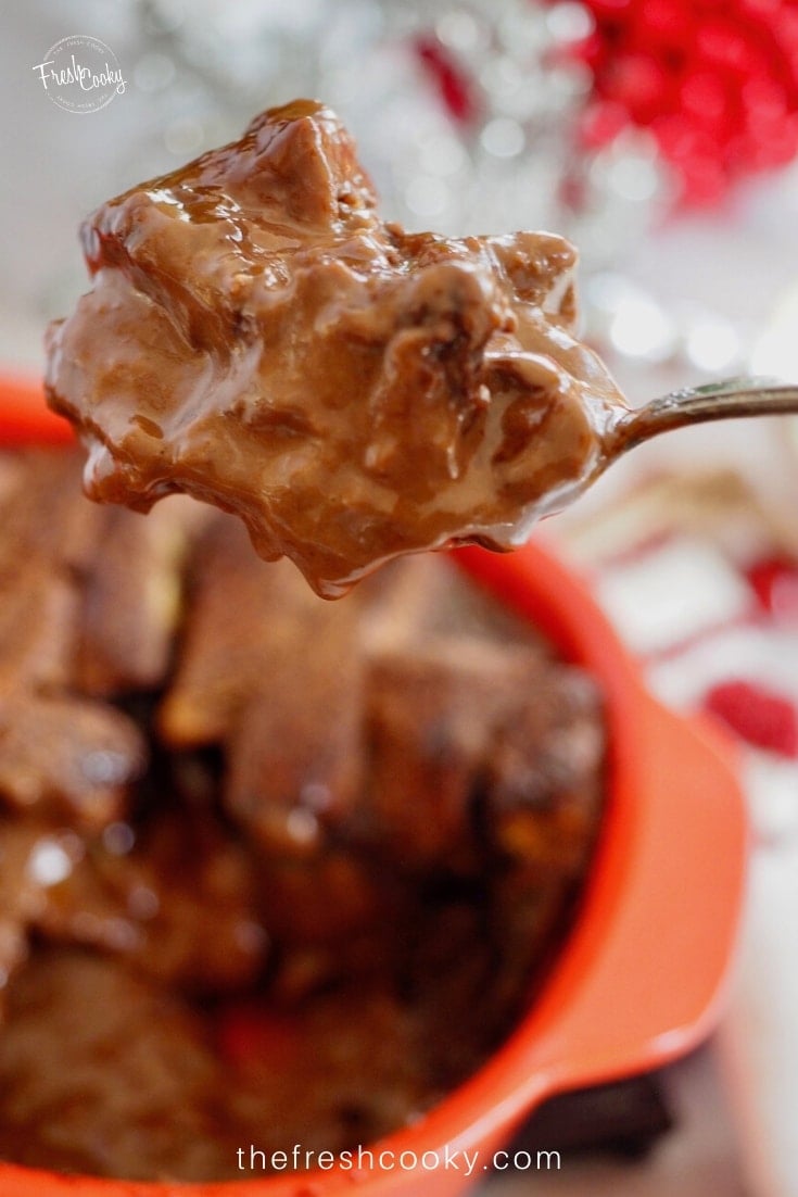 Spoonful of gooey, pudding like chocolate bread pudding.