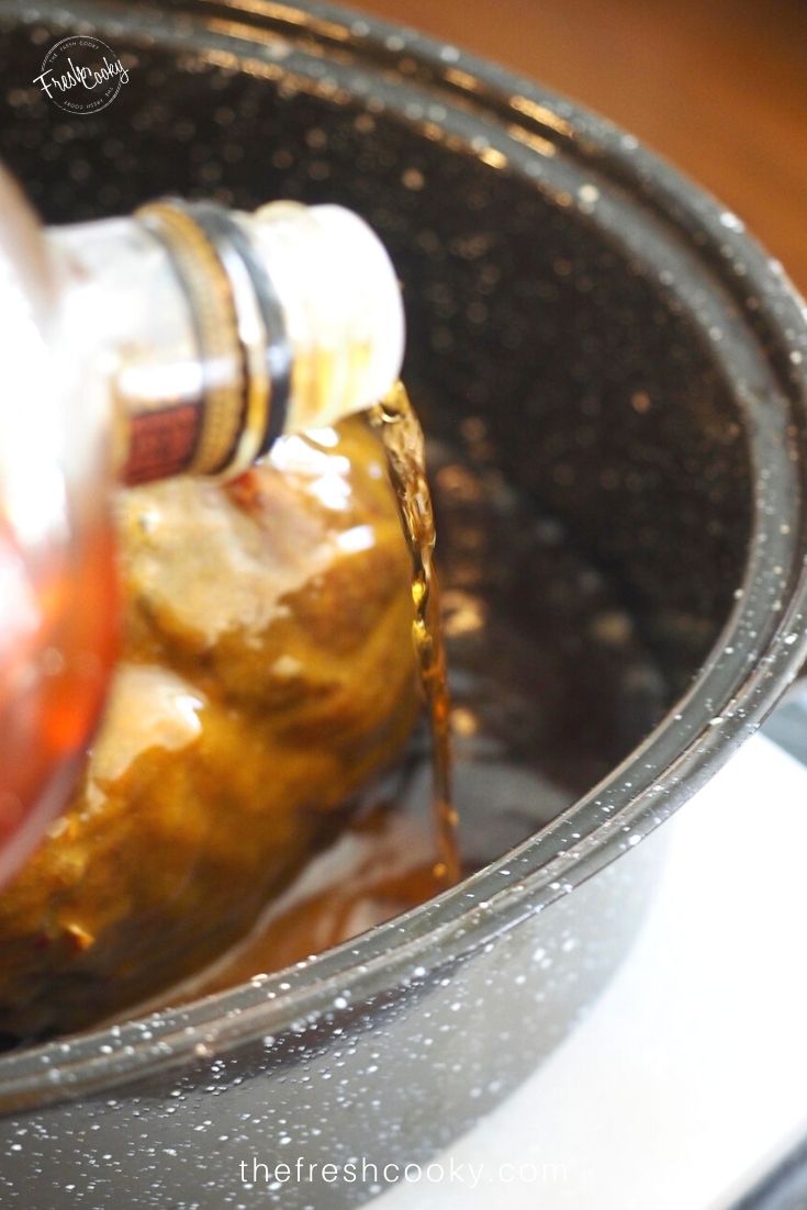 Pouring Bourbon in with Bourbon and Cola Glazed Ham | Recipe on thefreshcooky.com