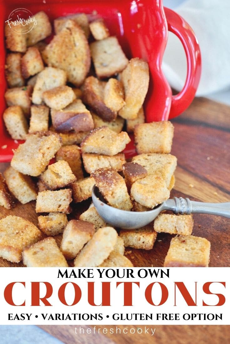 Pin for how to make your own croutons with variations. Crispy croutons spilled onto cutting board. 