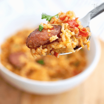Easy Instant Pot Jambalaya recipe with spoonful of chicken and sausage jambalaya, square format.