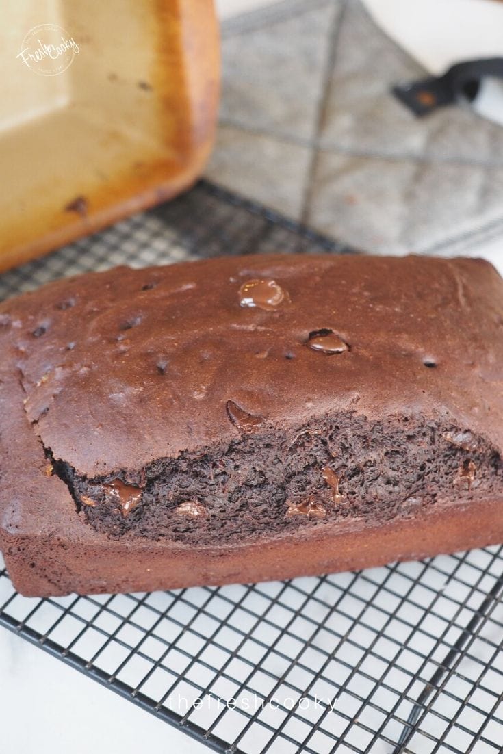Dark chocolate quick bread image sitting on a cooling rack
