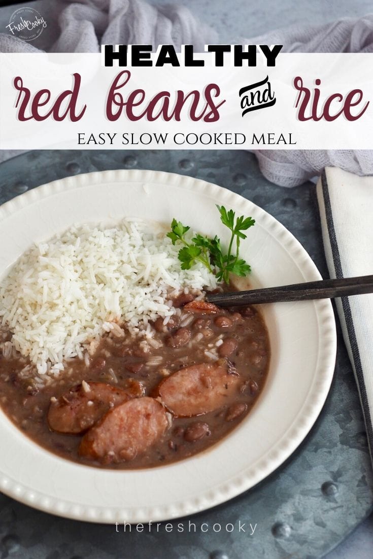 Pin for Slow Cooker Healthy Red Beans and Rice and easy slow cooked meal, image of slow cooked red beans and white rice in a bowl with a rustic spoon. 