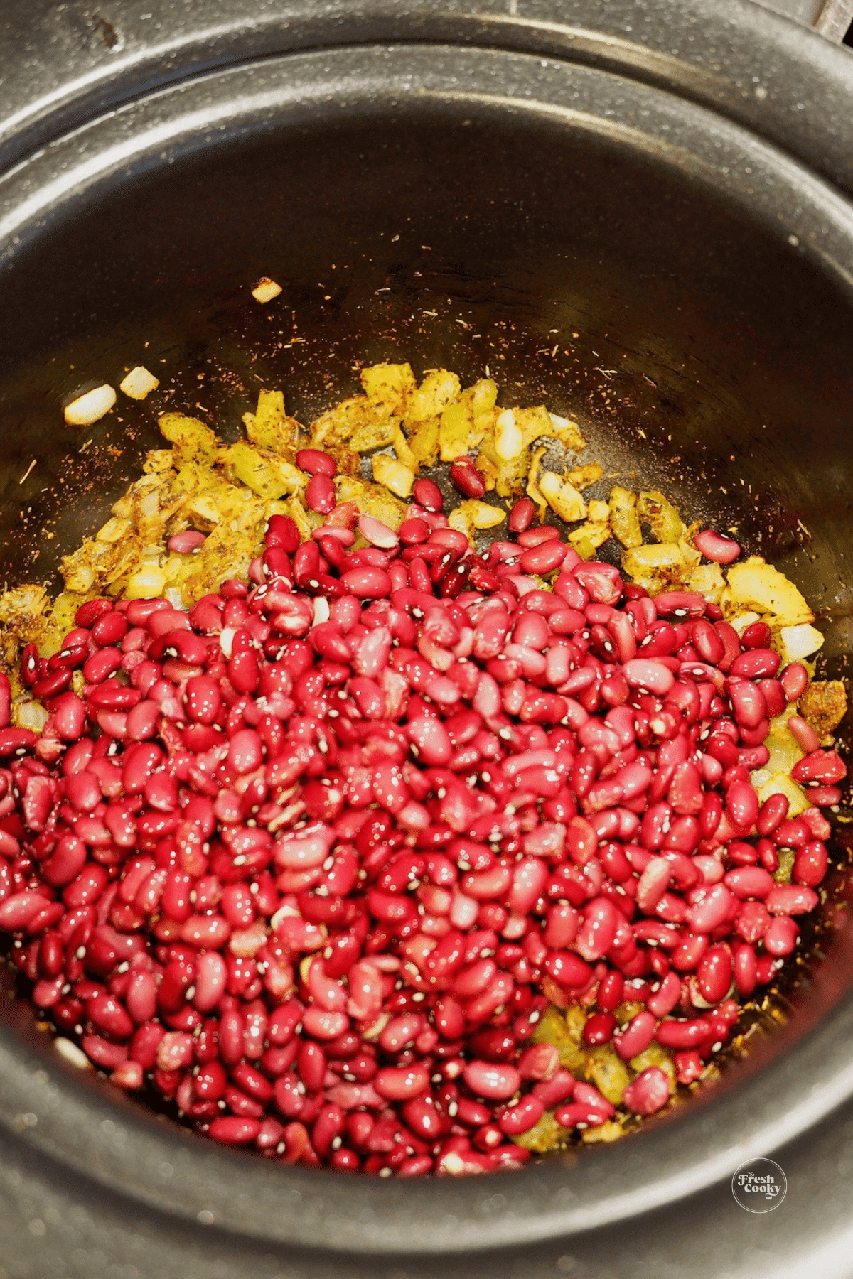 Red beans on top of sauted onions and celery.