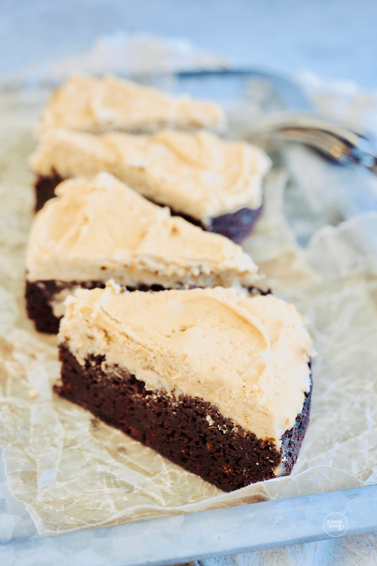 Slices of fudgy, dense chocolate Guinness cake with Baileys frosting.