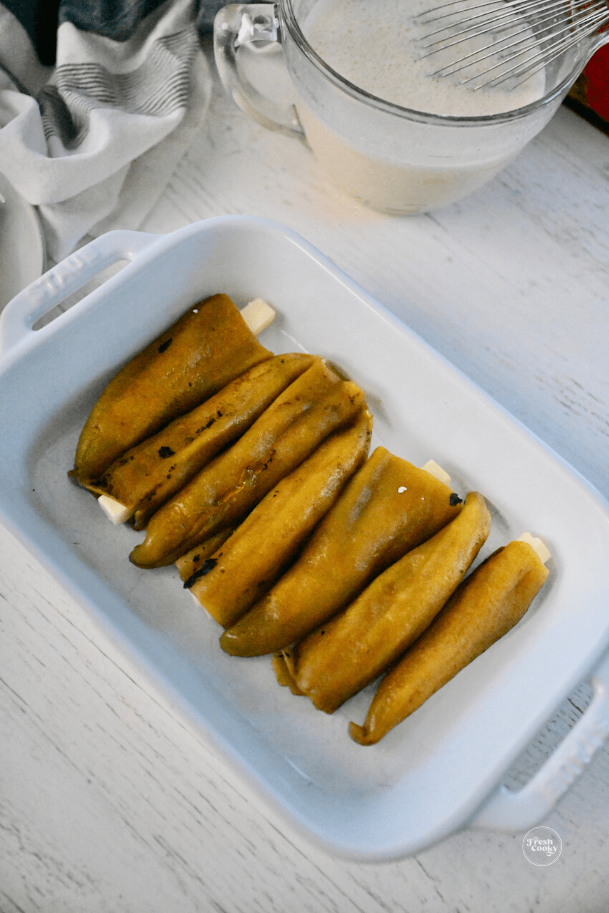 Single layer of green chiles stuffed with sticks of cheese. 