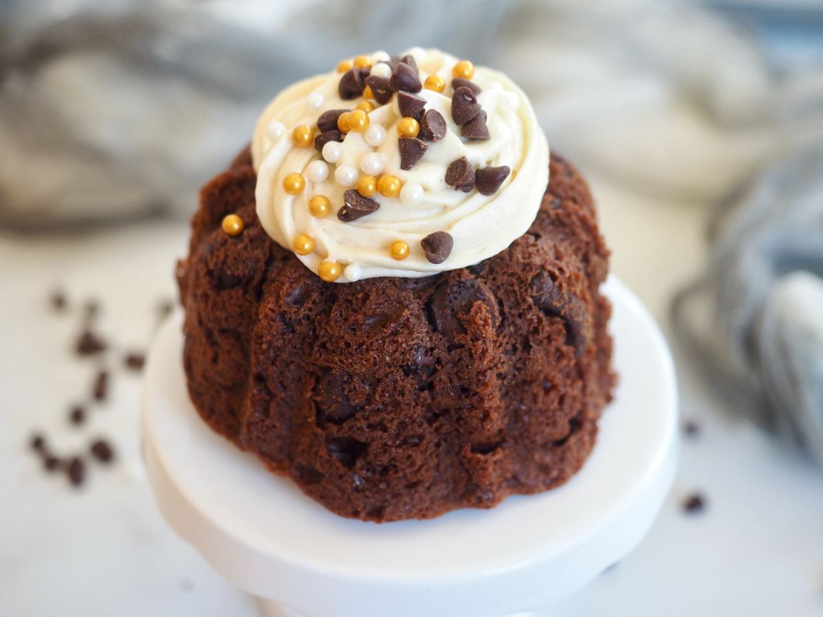 A mini Nothing bundt cake on a mini pedestal.