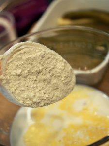 Adding flour a little at a time to egg and milk mixture for chile rellenos | thefreshcooky