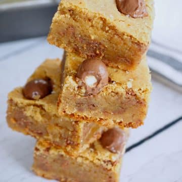 Gooey, chewy blondies stacked on top of each other.