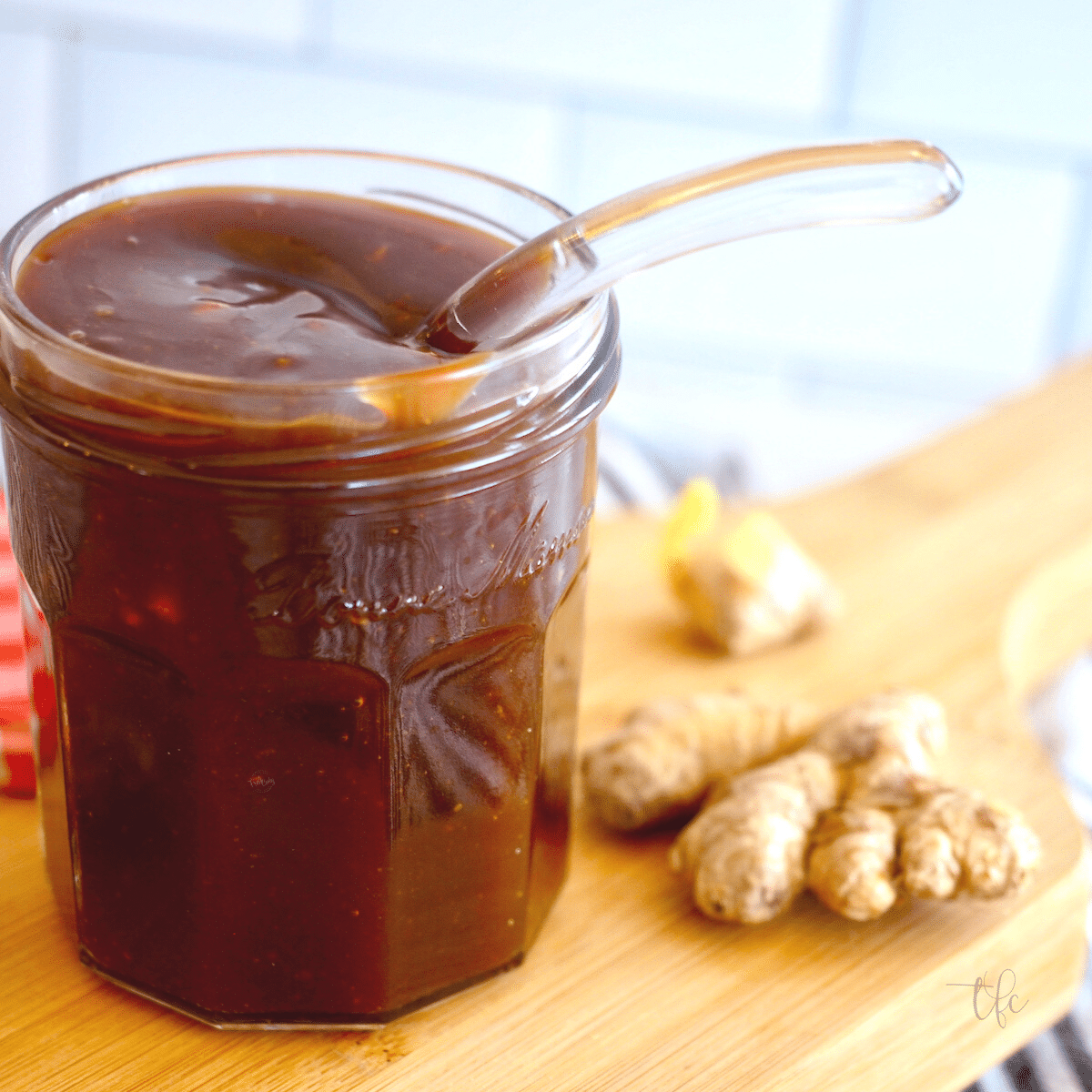 Easy teriyaki sauce recipe with spoon in jar and ginger slices nearby. l