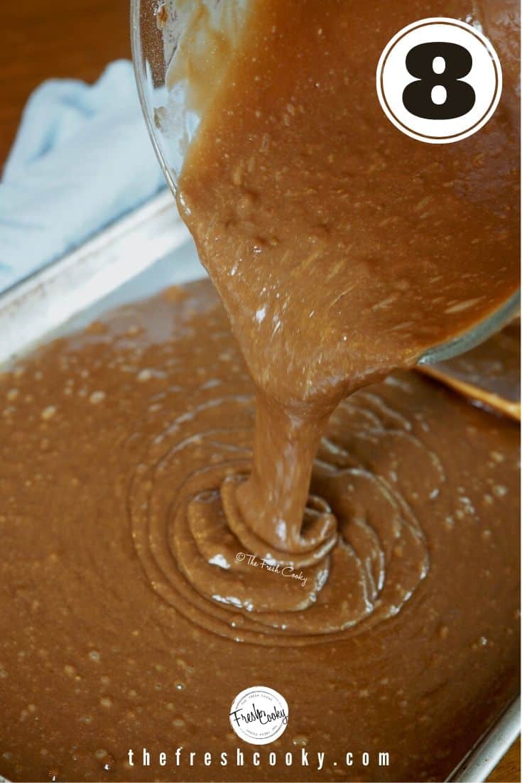 Pouring chocolate cake batter into prepared sheet pan