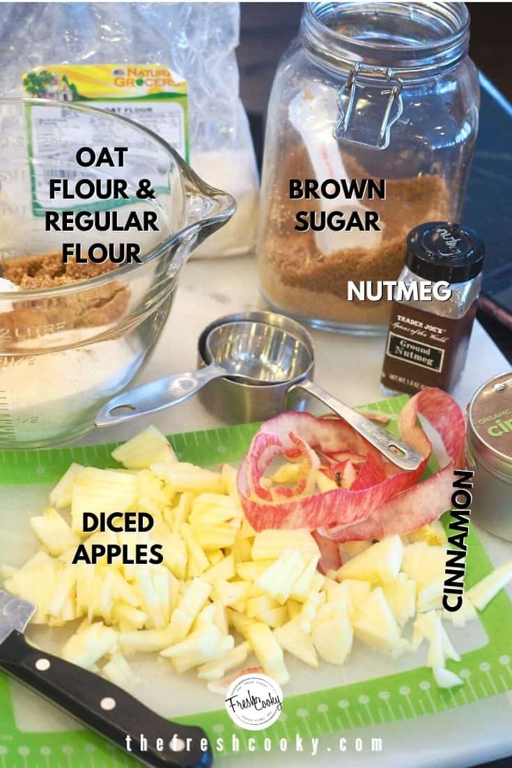 Partial Ingredients image for Apple Crumb Cake left to right oat flour, regular flour, brown sugar, nutmeg, cinnamon, apples.
