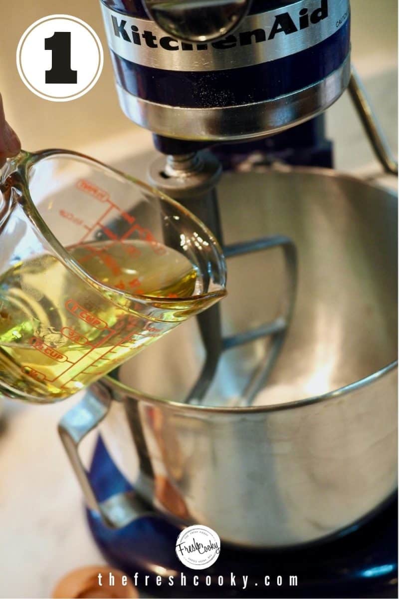 Glass liquid measuring cup pouring in avocado oil