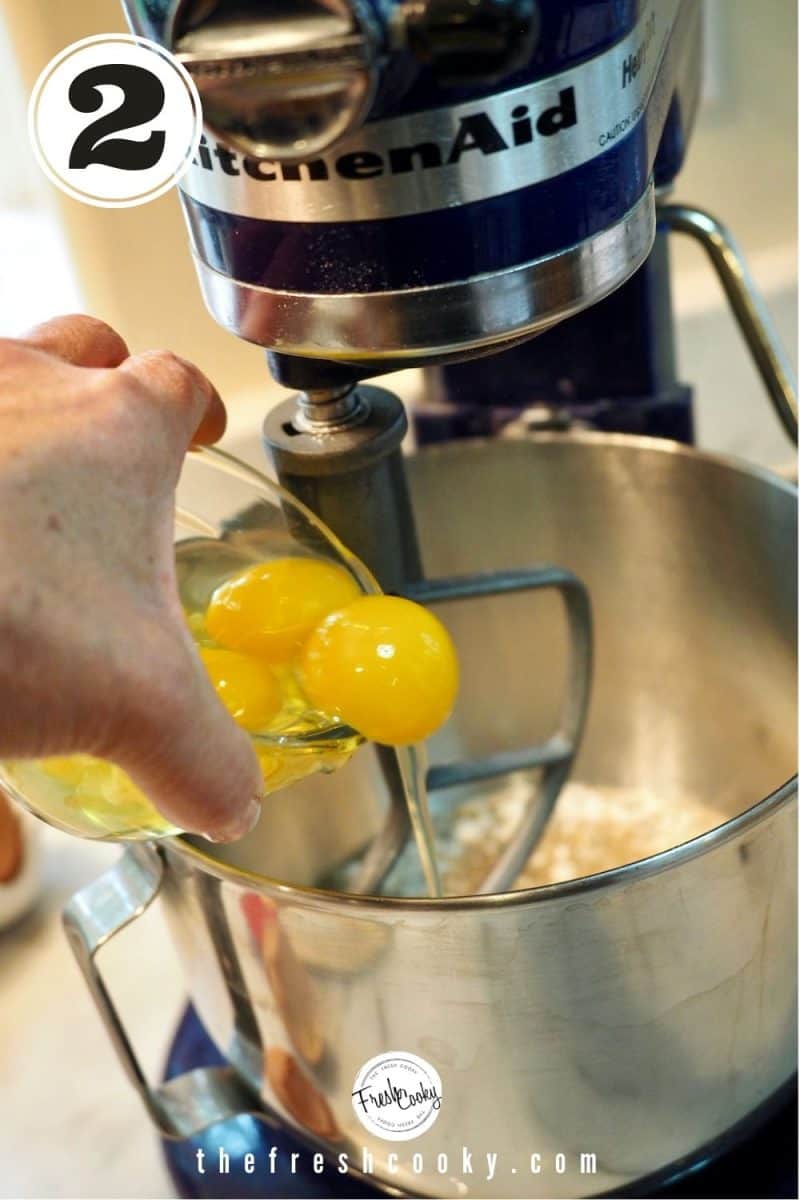 pouring 4 eggs into bowl of stand mixer