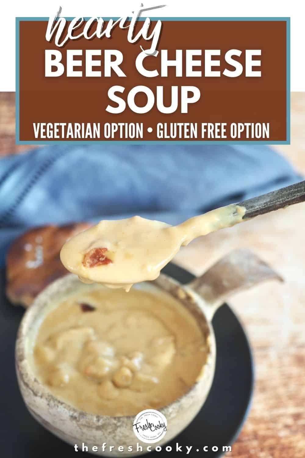Pinterest Image with type saying Hearty Beer Cheese Soup vegetarian and gluten free options with image of beer cheese soup in bowl with spoonful of soup and a blue napkin in the background.
