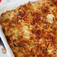 Close up image of chicken and wild rice casserole with crispy onions