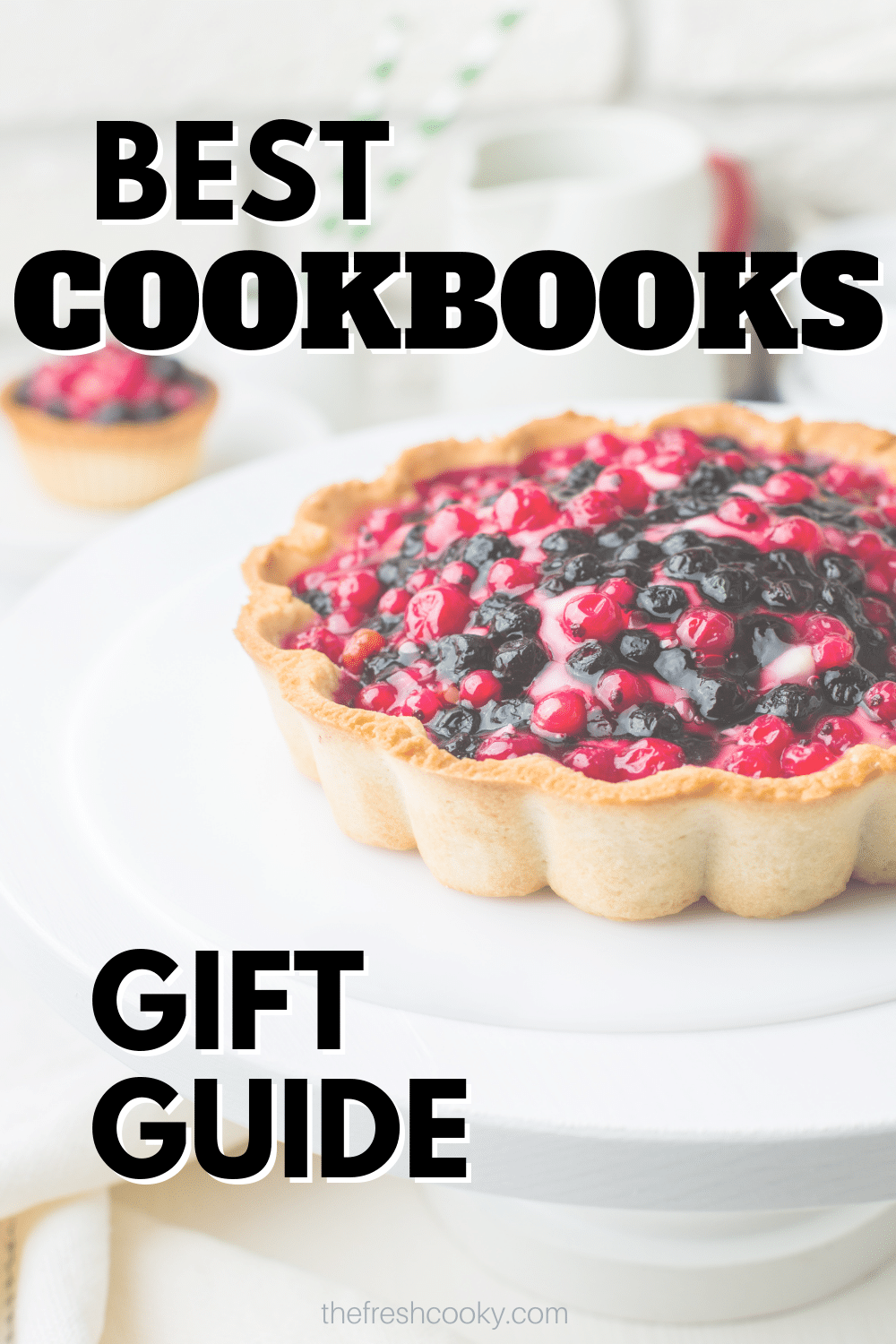 Best cookbooks gift guide pin with image of fruit tart on the counter.