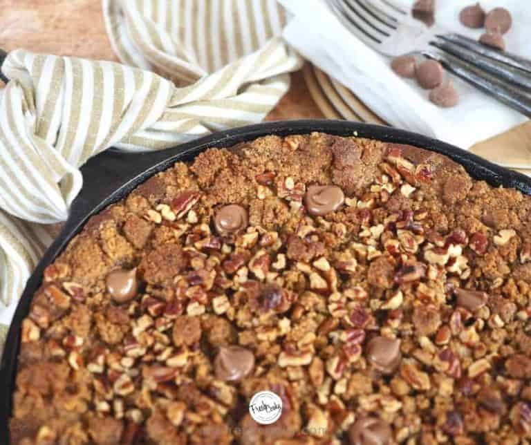 Facebook image portion of chocolate pumpkin graham crisp in cast iron skillet with tea towel tied to hot handle.