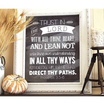 Fall mantle, wheat in a bucket, with pumpkin, framed art with Proverbs 3:5-6 on it, candle on rustic stand with mum laying beside.