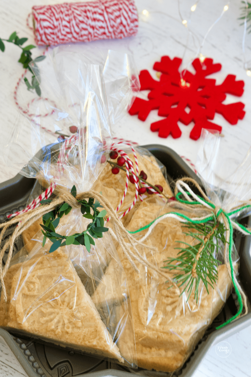 Shortbread snowflake wedges made in a mold, in cello bags for gifting.