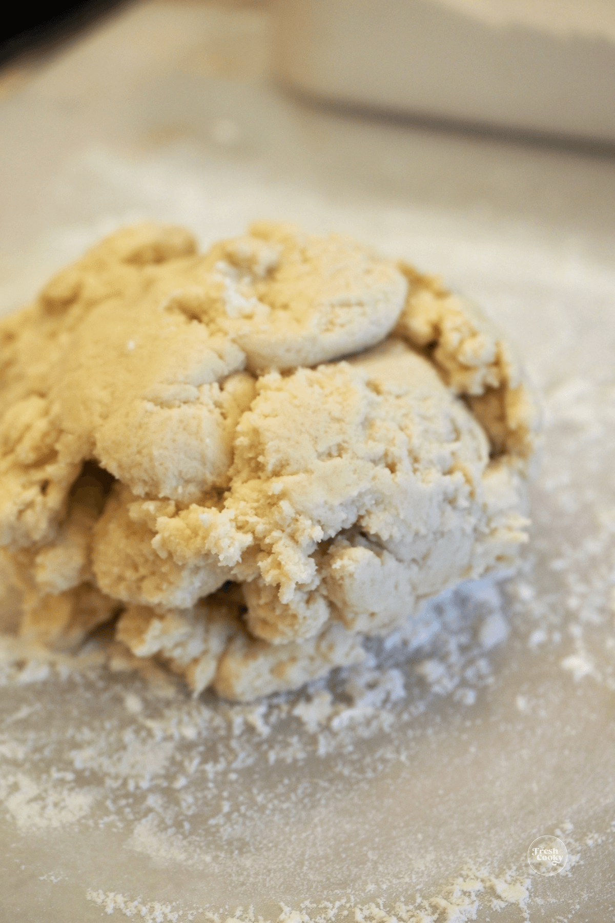 Crumbly shortbread dough on baking sheet.