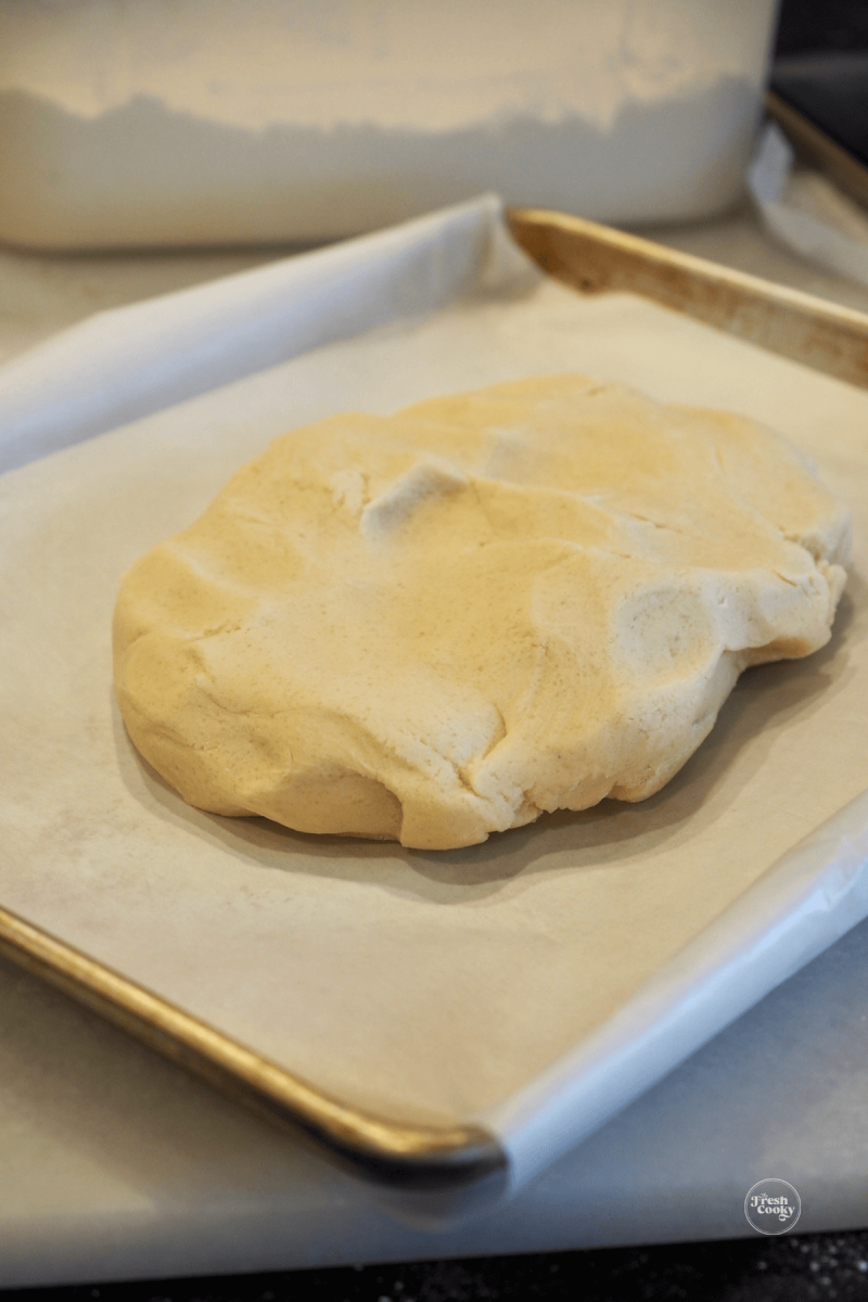 Press shortbread dough into parchment lined baking sheet. 