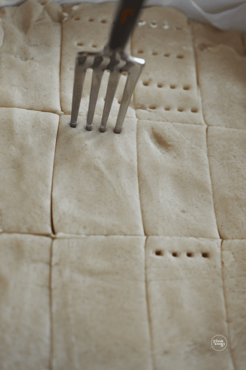 Score and prick shortbread with tines of fork for classic shortbread look.