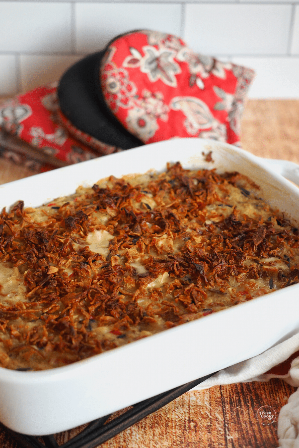 Wild Rice Casserole with chicken or turkey in a dish topped with crispy onions.