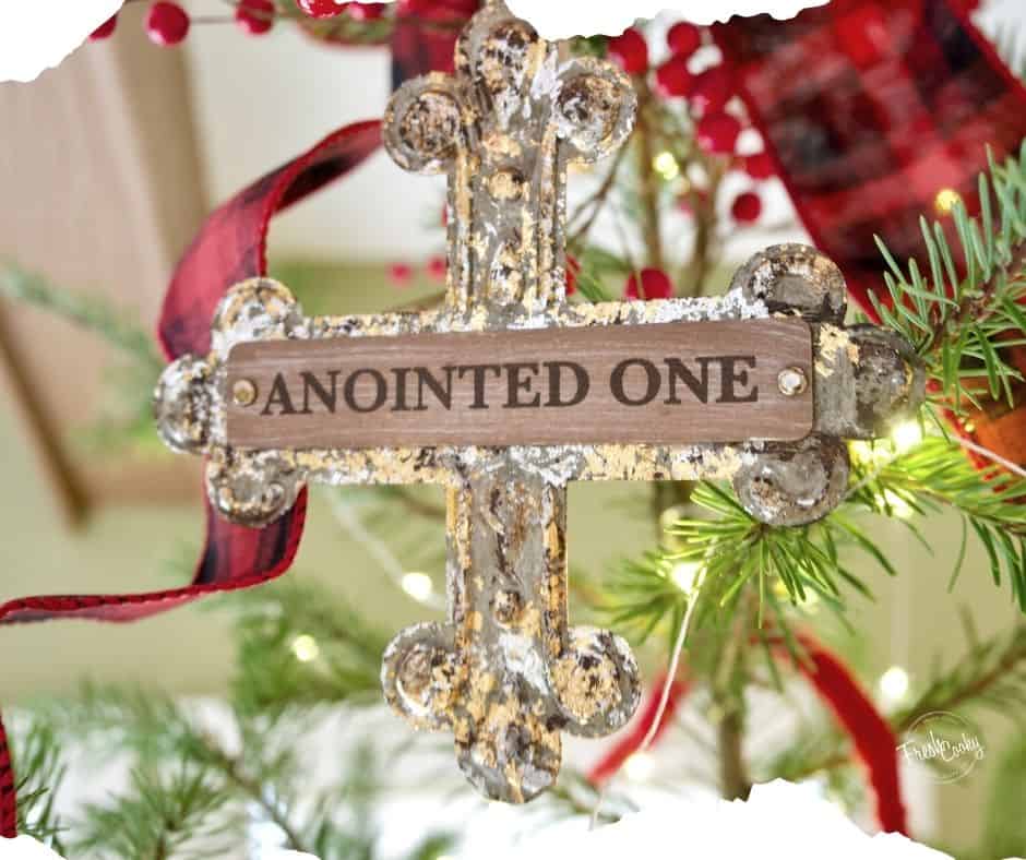 Image of cross that says Anointed One on Christmas tree