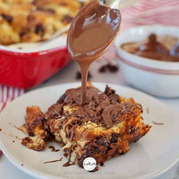 FB Image with spoon drizzling Nutella on a square of chocolate croissant french toast.