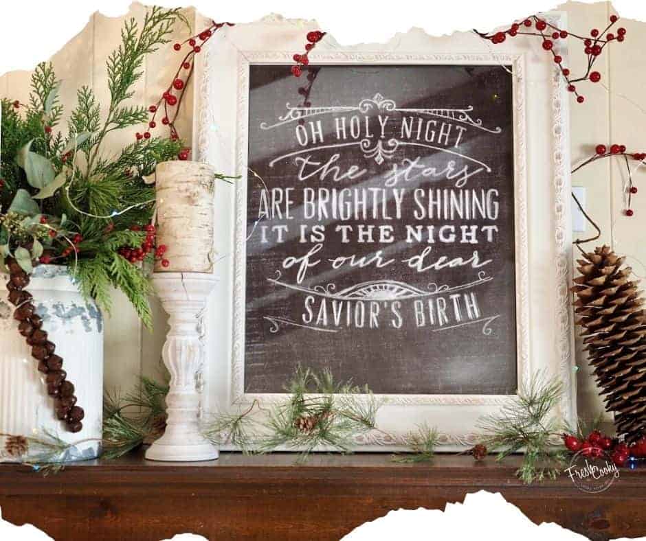 Image of Christmas decorated mantle, with words to O Holy Night, framed and tin of evergreens.