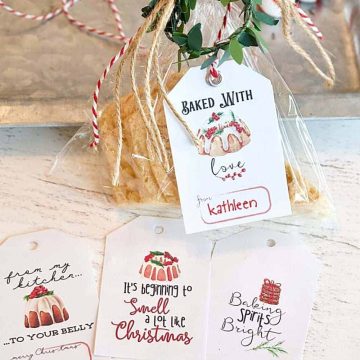 cello wrapped cookie tied with free gift tag that says, baked with love, along with three other free printable gift tags