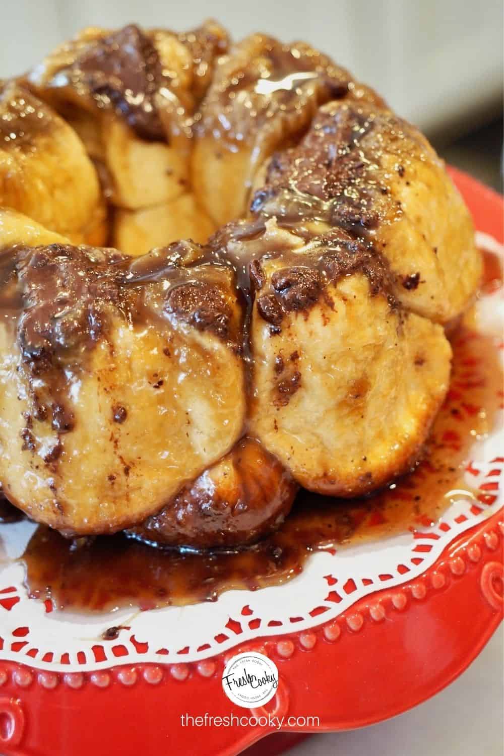 Chocolate Stuffed Monkey Bread on a red platter with doily.