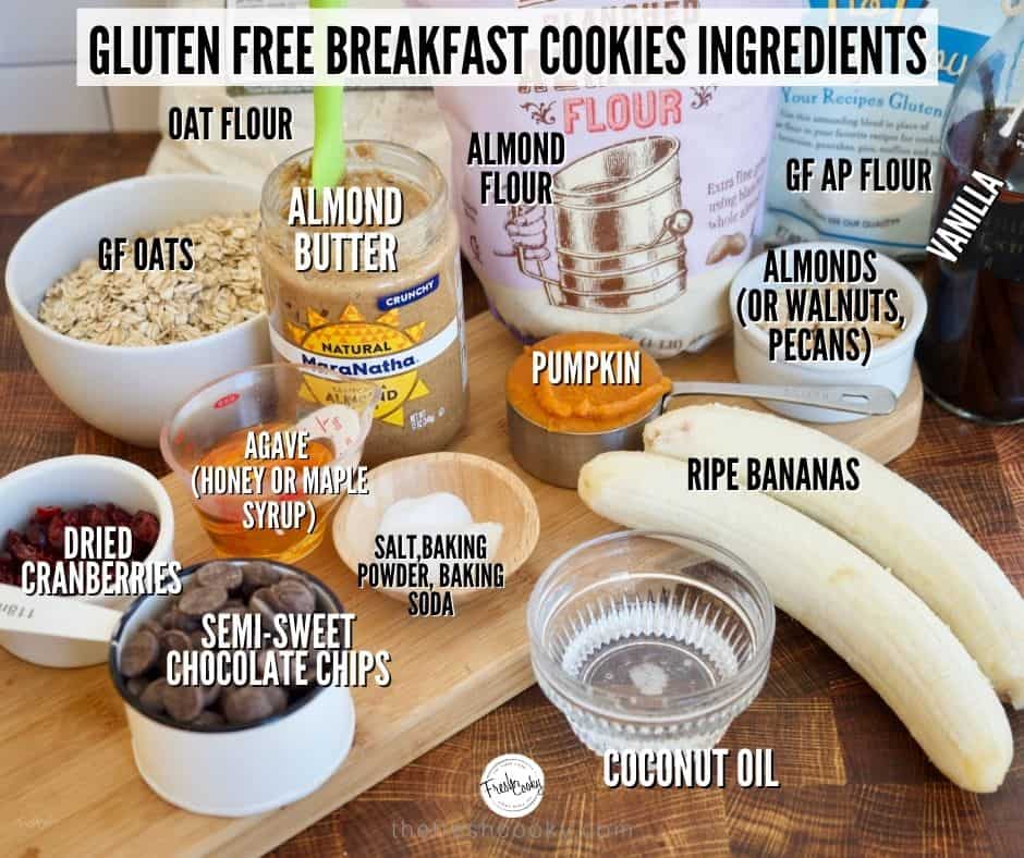 Healthy Gluten Free Breakfast Cookies Ingredients image. L-R Oats, Oat Flour, Almond flour, GF AP Flour, almonds, bananas, coconut oil, pumpkin puree, salt, baking powder, baking soda, almond butter, agave syrup, chocolate chips, craisins