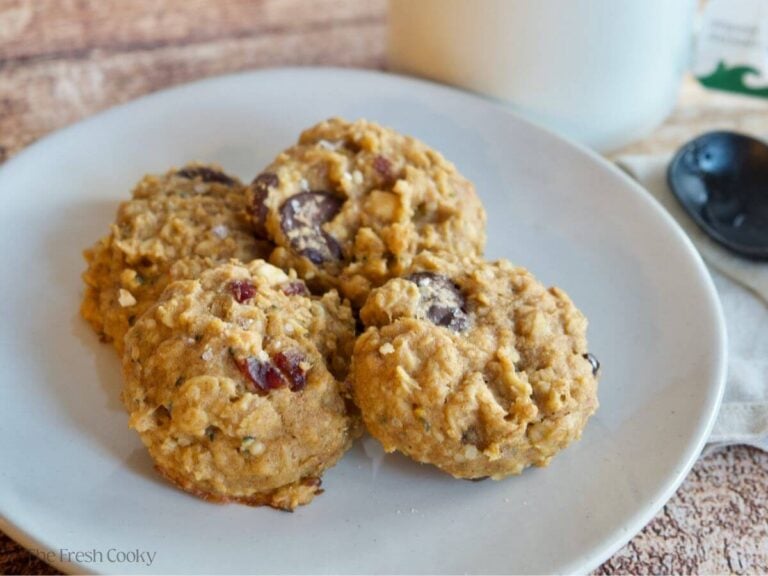 Four breakfast cookies on a white plate.