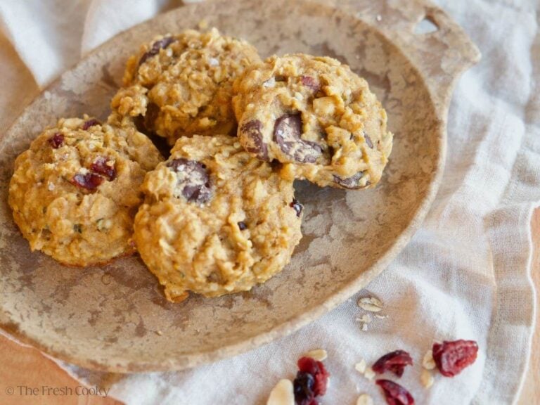 Four breakfast cookies on a plate.