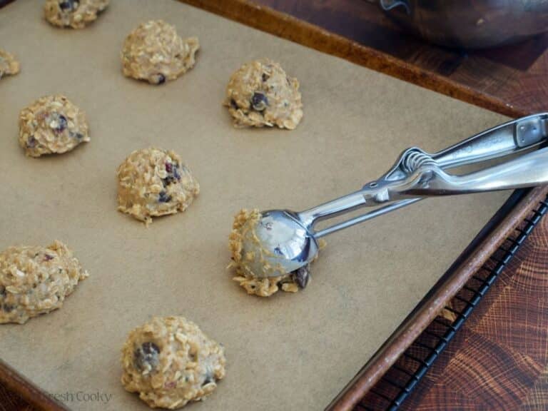 Scooping cookie dough with mediums scoop.