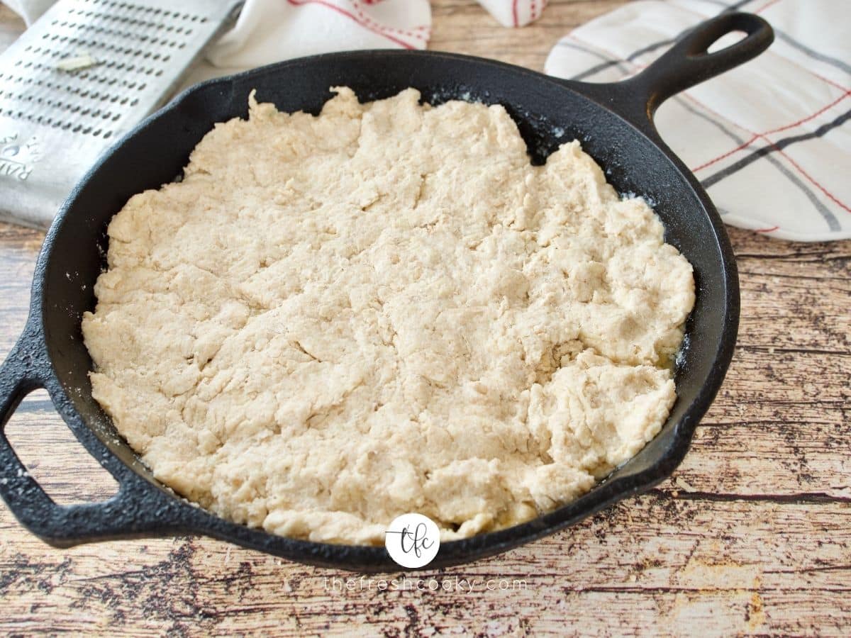 red lobster cheddar biscuit dough pressed into cast iron skillet.