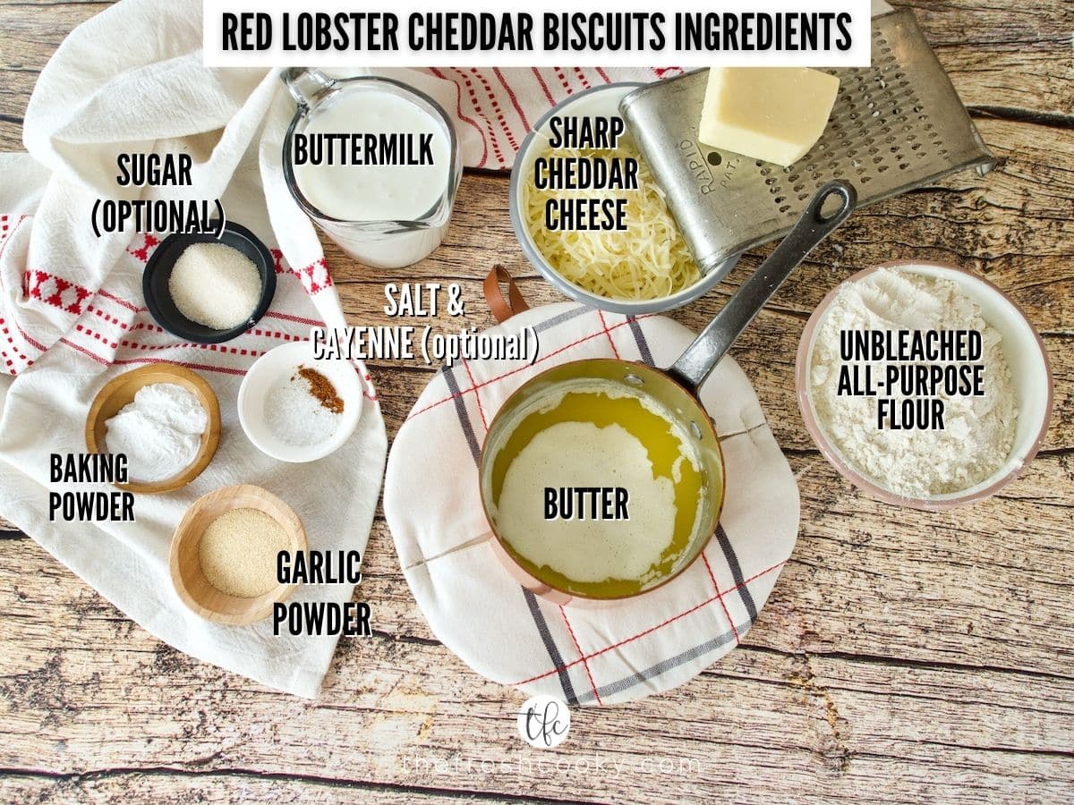 ingredient shot for red lobster cheddar biscuits, L-R Buttermilk, sharp cheddar cheese, flour, melted butter, garlic powder, baking powder, salt, cayenne, sugar.