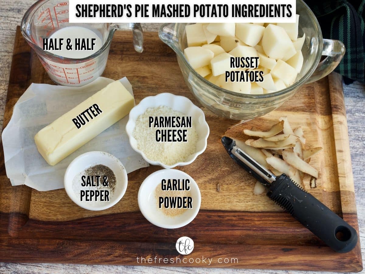 Ingredient shot for Mashed Potatoes, L-R Half & Half, cubed potatoes, parmesan cheese, garlic powder, salt & pepper, butter.