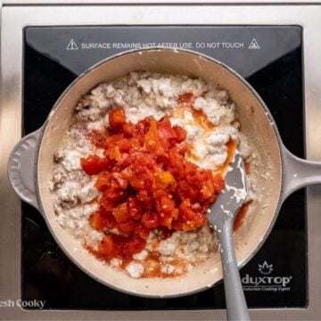 Add Rotel tomatoes and mix in.