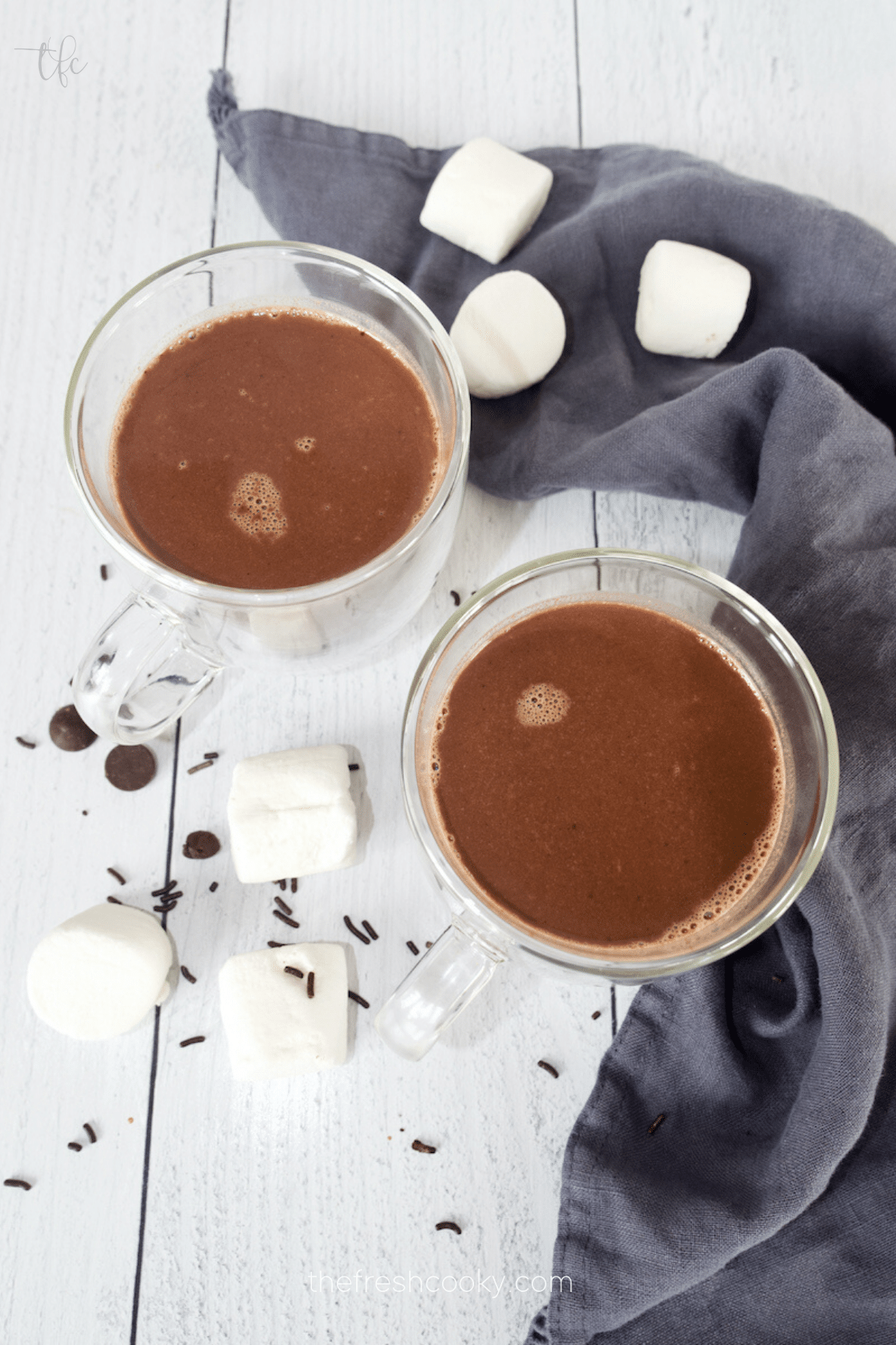 European Hot Chocolate in glass mugs, rich and thick homemade hot chocolate with chocolate chips.