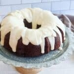 Vanilla glaze poured over a chocolate bundt cake.