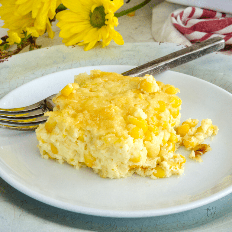 Slice of light and fluffy creamy corn pudding casserole. 